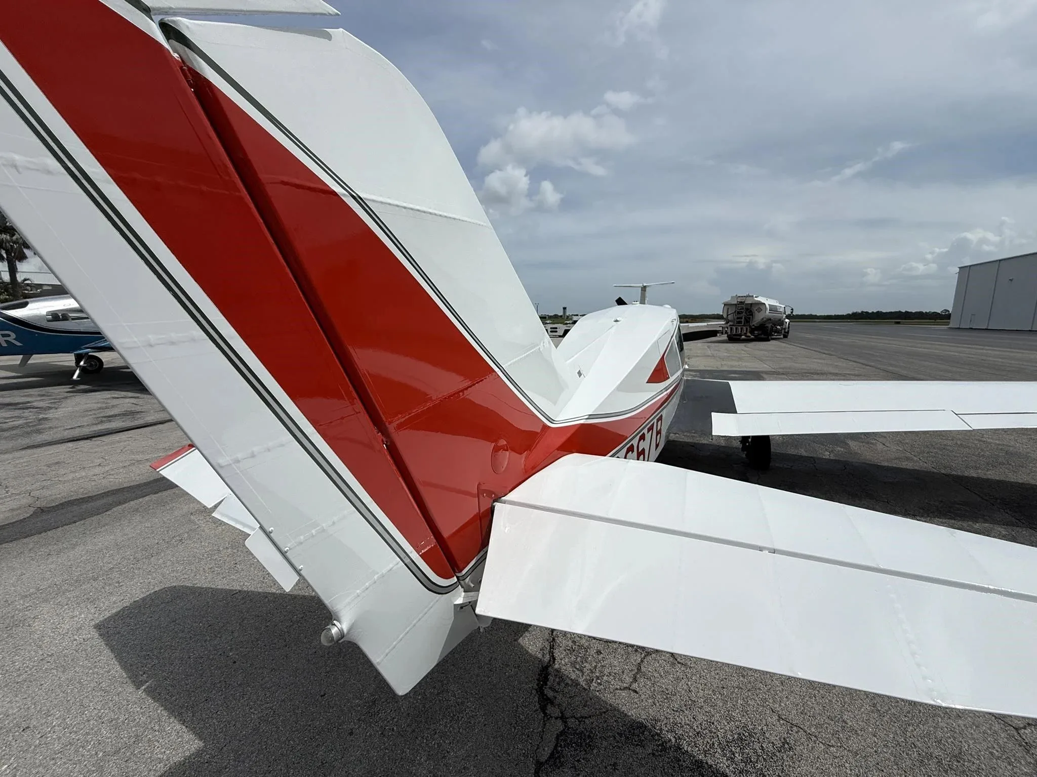A close-up view of the red and white tail section of the aircraft, N2667B.