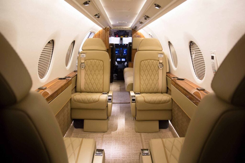 View of the aircraft's cabin with tan leather seats.