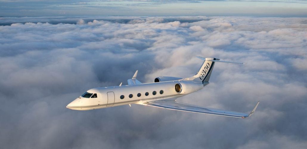 A Gulfstream G350 flying above the clouds.