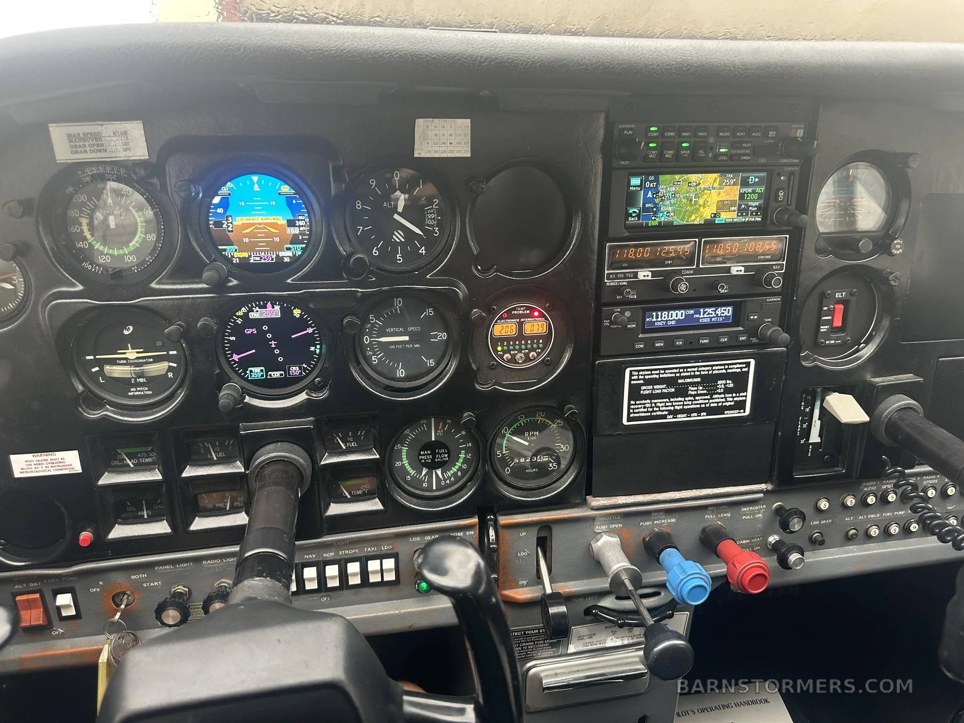 A close-up view of the Cessna 182 cockpit instrument panel, showing various flight instruments, engine gauges, and avionics.