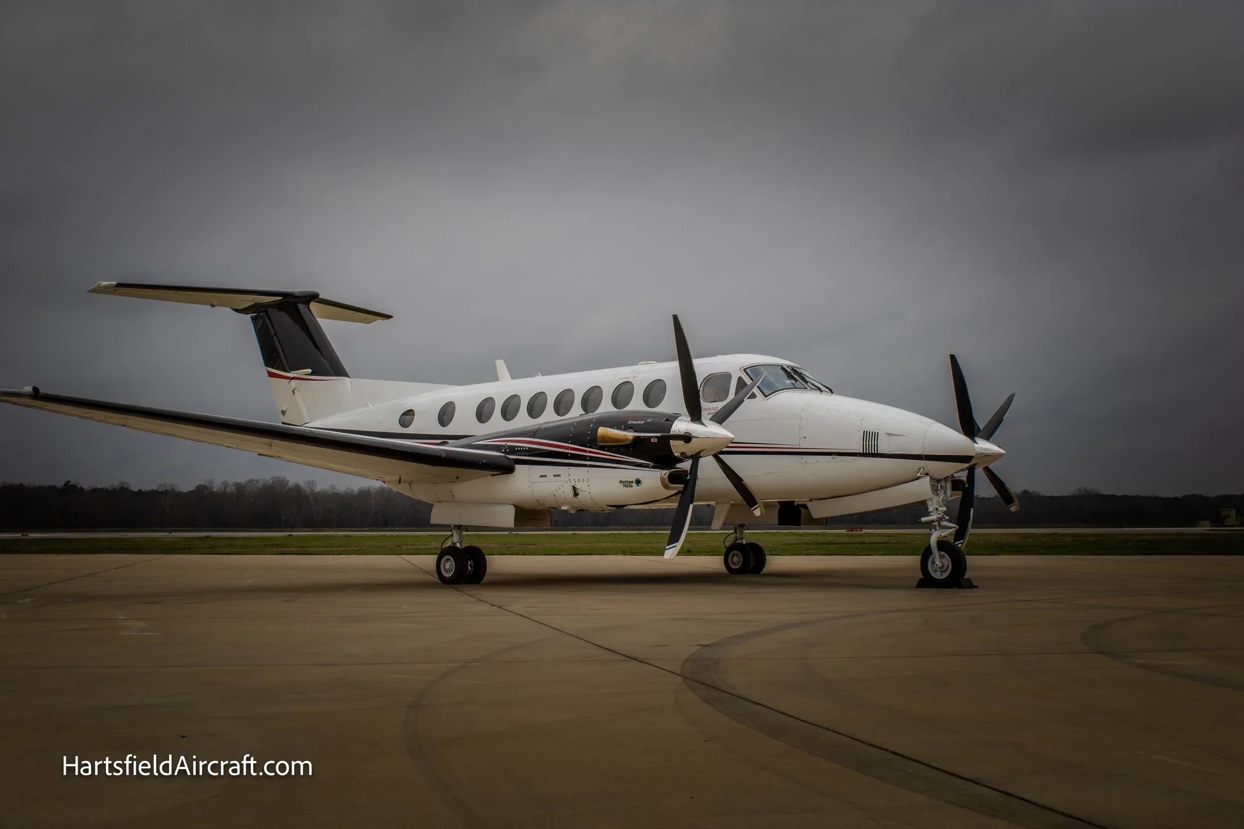 Side view of a King Air 360 on the tarmac.