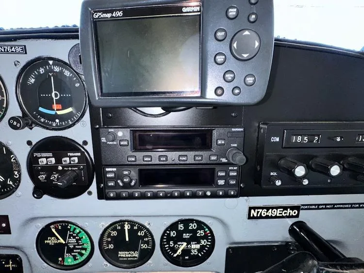 A close-up of the avionics stack in the Bellanca 7GCBC Citabria N7649E cockpit, featuring a Garmin GPSmap 496.