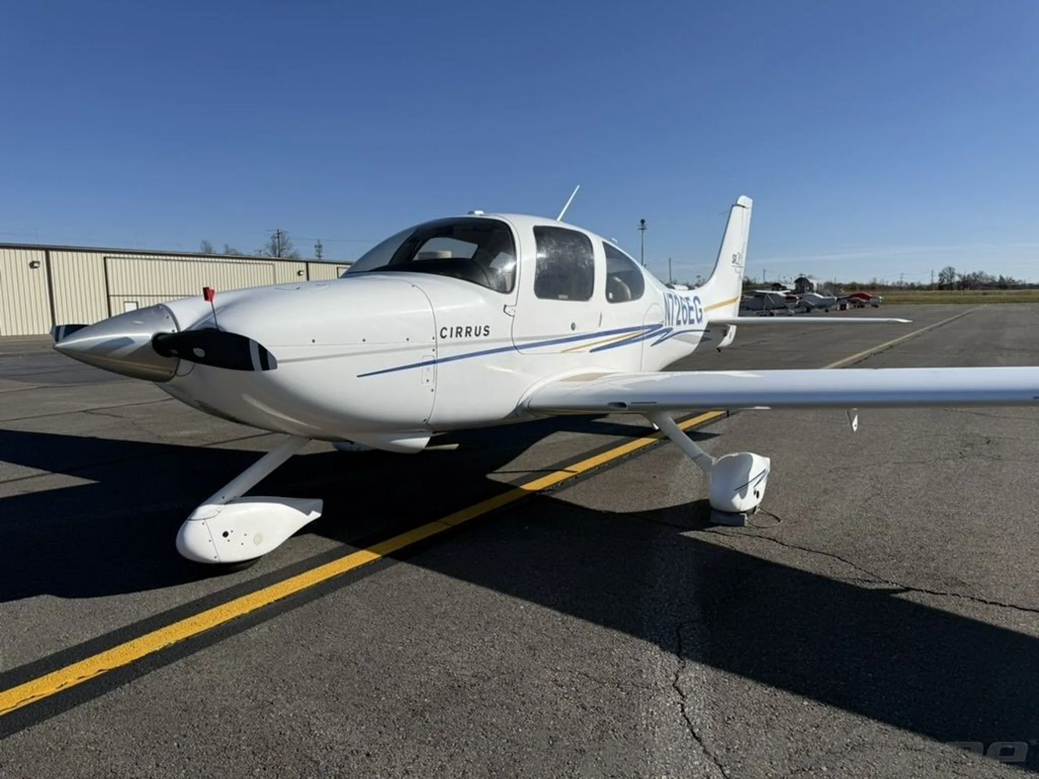 A front view of the Cirrus SR20-G2 on the ground.