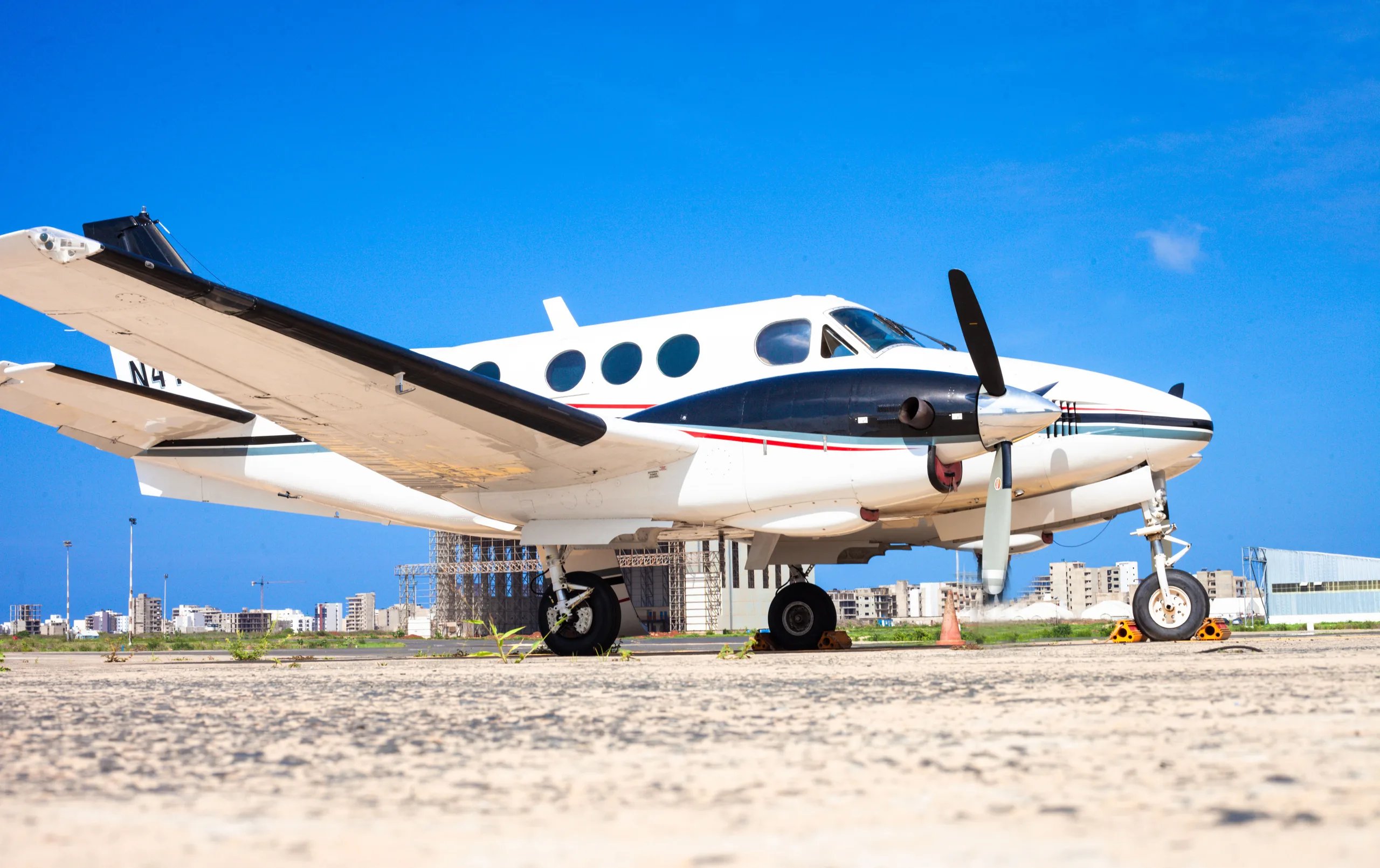 A King Air N411FT is parked on the tarmac.