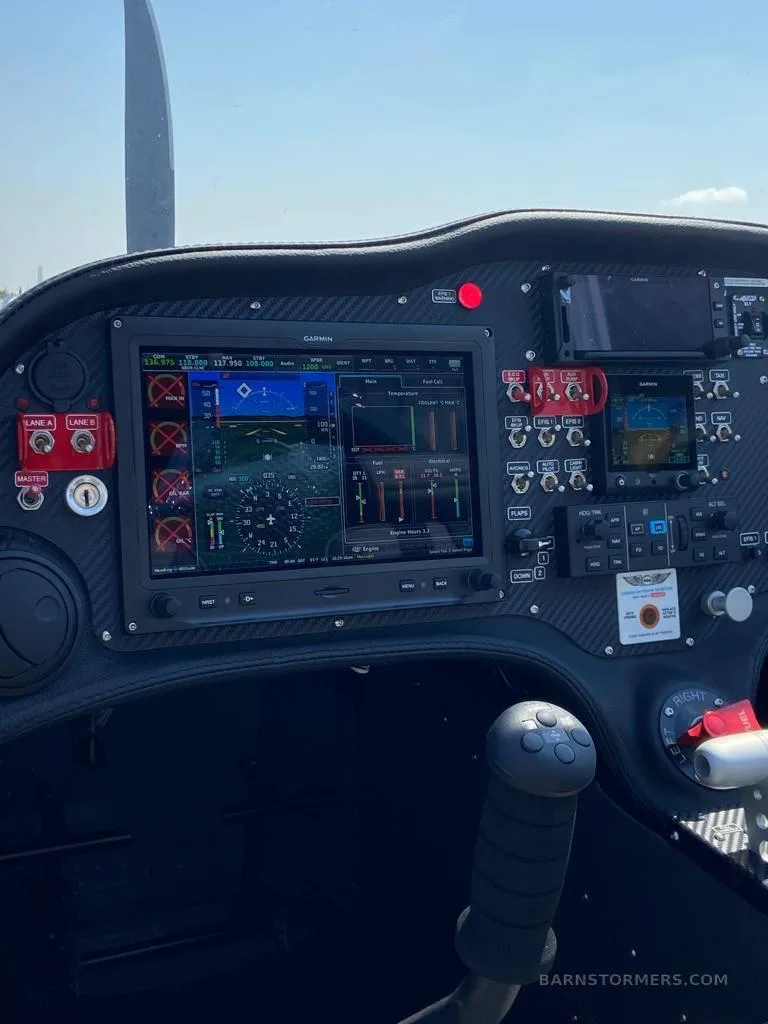 A close-up view of the Sling aircraft's cockpit, highlighting the Garmin G3X Touch display showing flight and engine data.