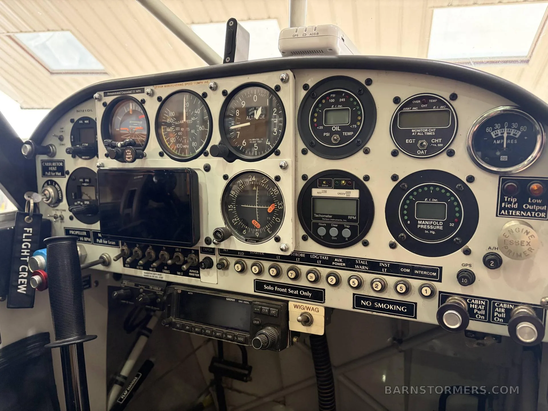 The instrument panel of an Aviat Aircraft Husky, featuring analog gauges, digital displays, and various controls.