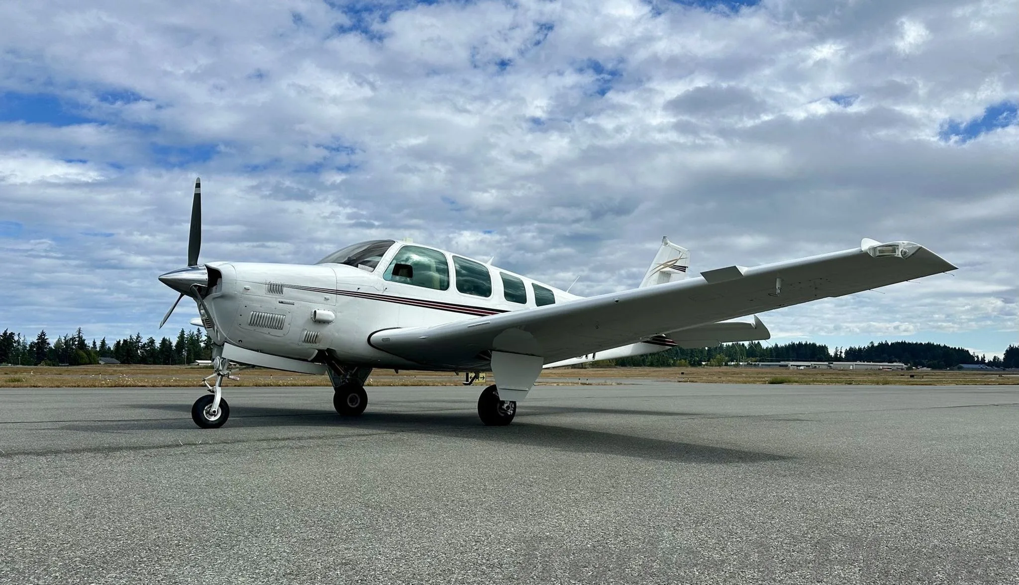 A side view of the Beechcraft B36TC Bonanza on the runway.