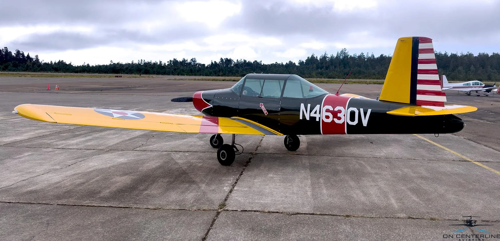 A full side view of the N4630V aircraft, showcasing its black, red, and yellow livery with a US star on the wing.