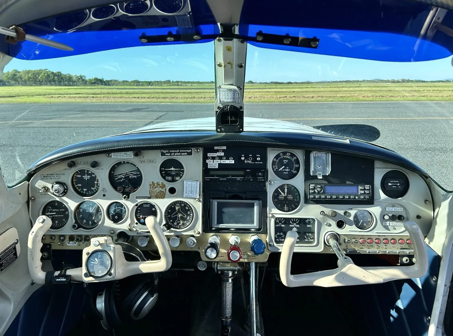 The cockpit of the Mooney M20J, showing the instrument panel and controls.