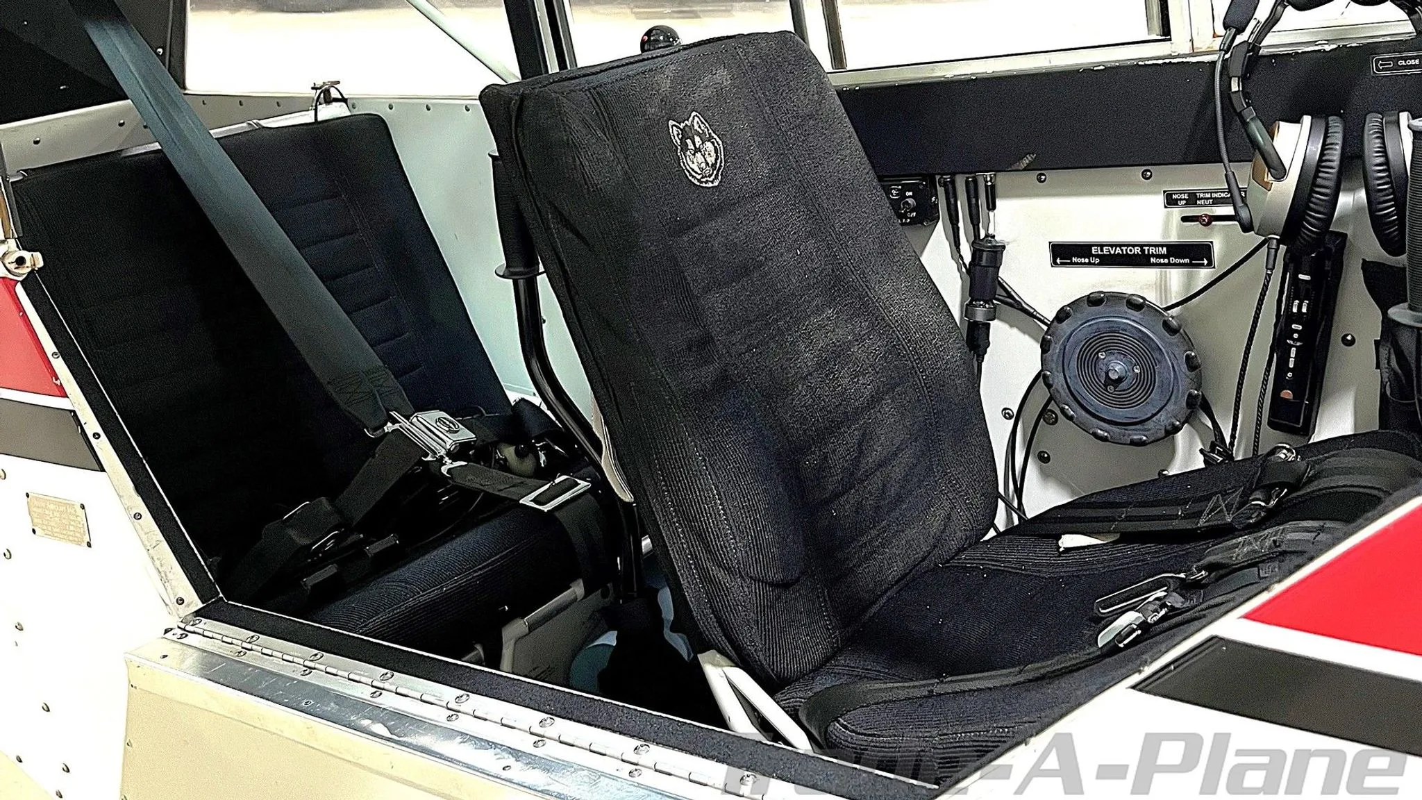 Interior view of the cabin seats in the 1999 Aviat Husky A-1B.
