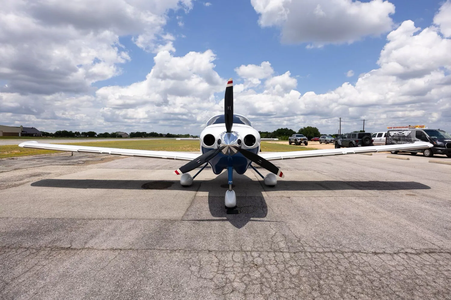 A head-on view of the Cessna TTX N530JM with its propeller, parked on a tarmac.