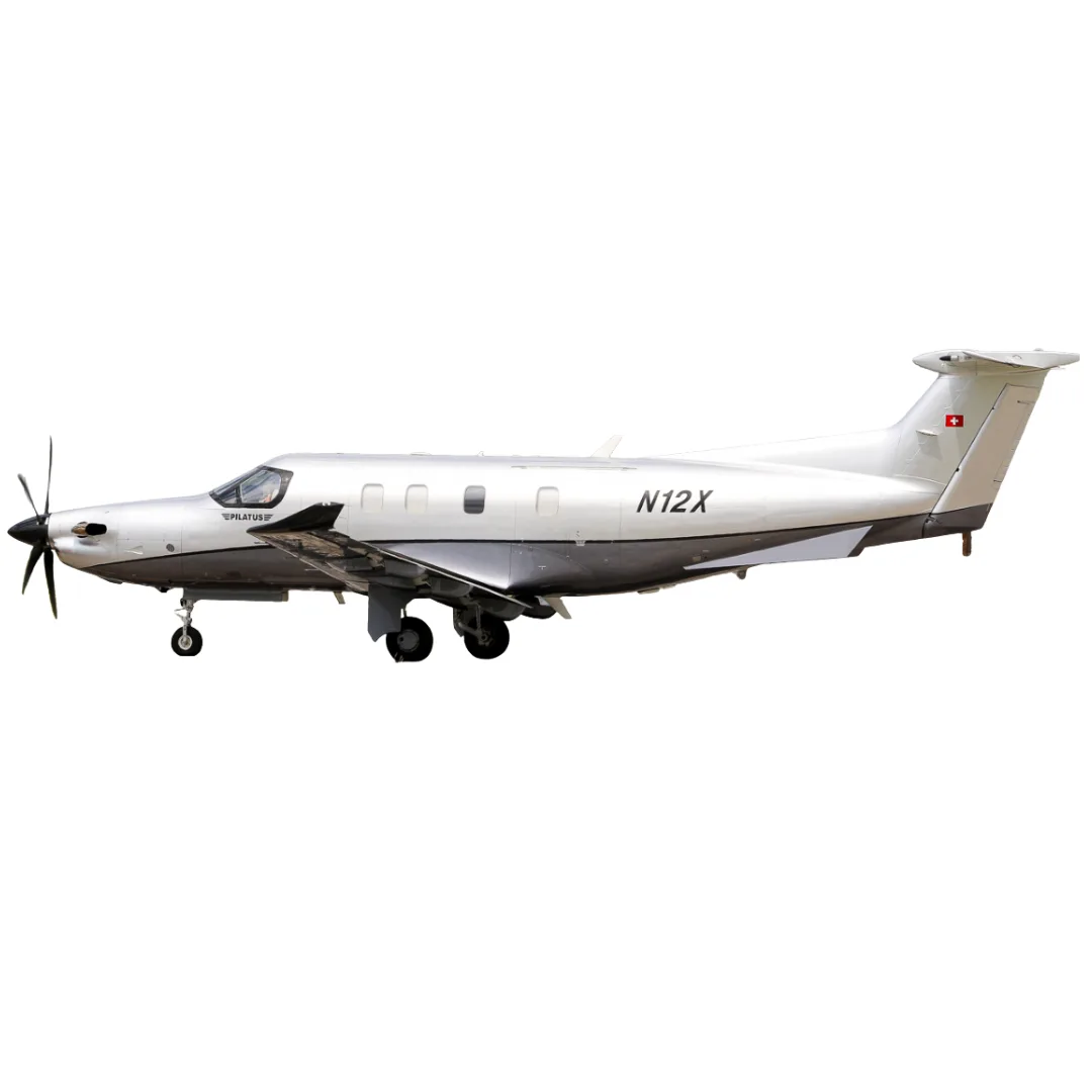 A silver and grey Pilatus PC-12 turboprop aircraft with registration N12X, viewed from the side against a white background.
