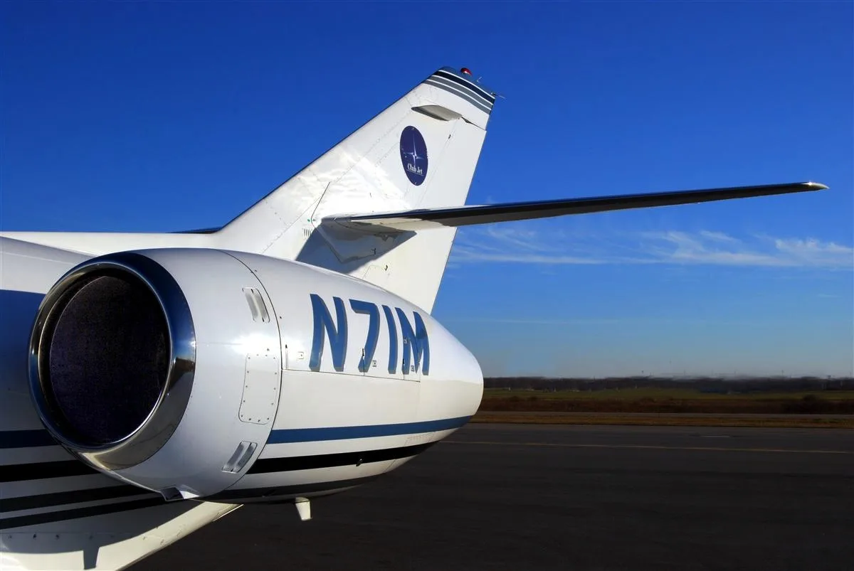 Close-up of the aircraft's tail and engine with registration number N71M.