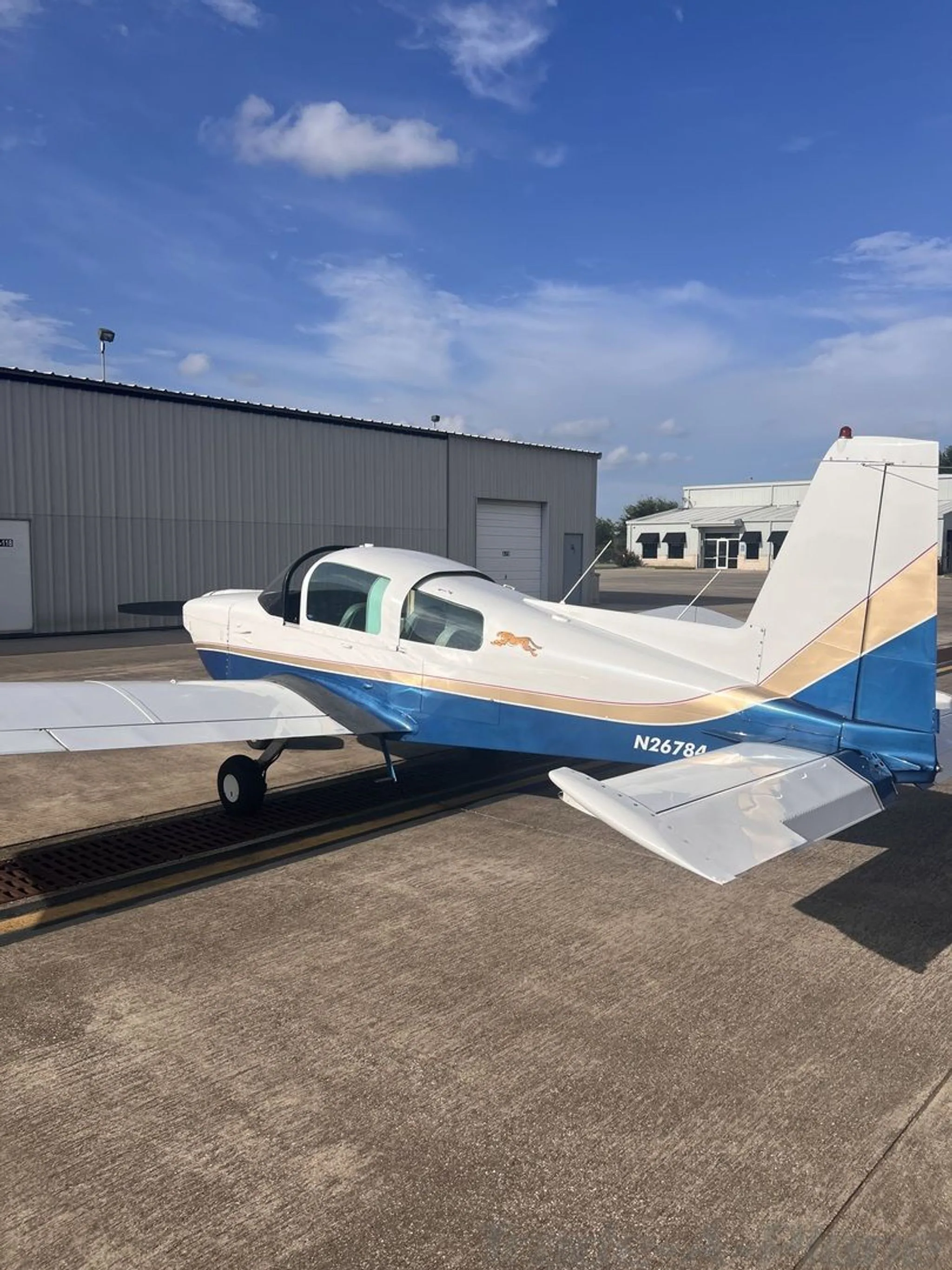 A side view of the aircraft with a clear sky in the background.