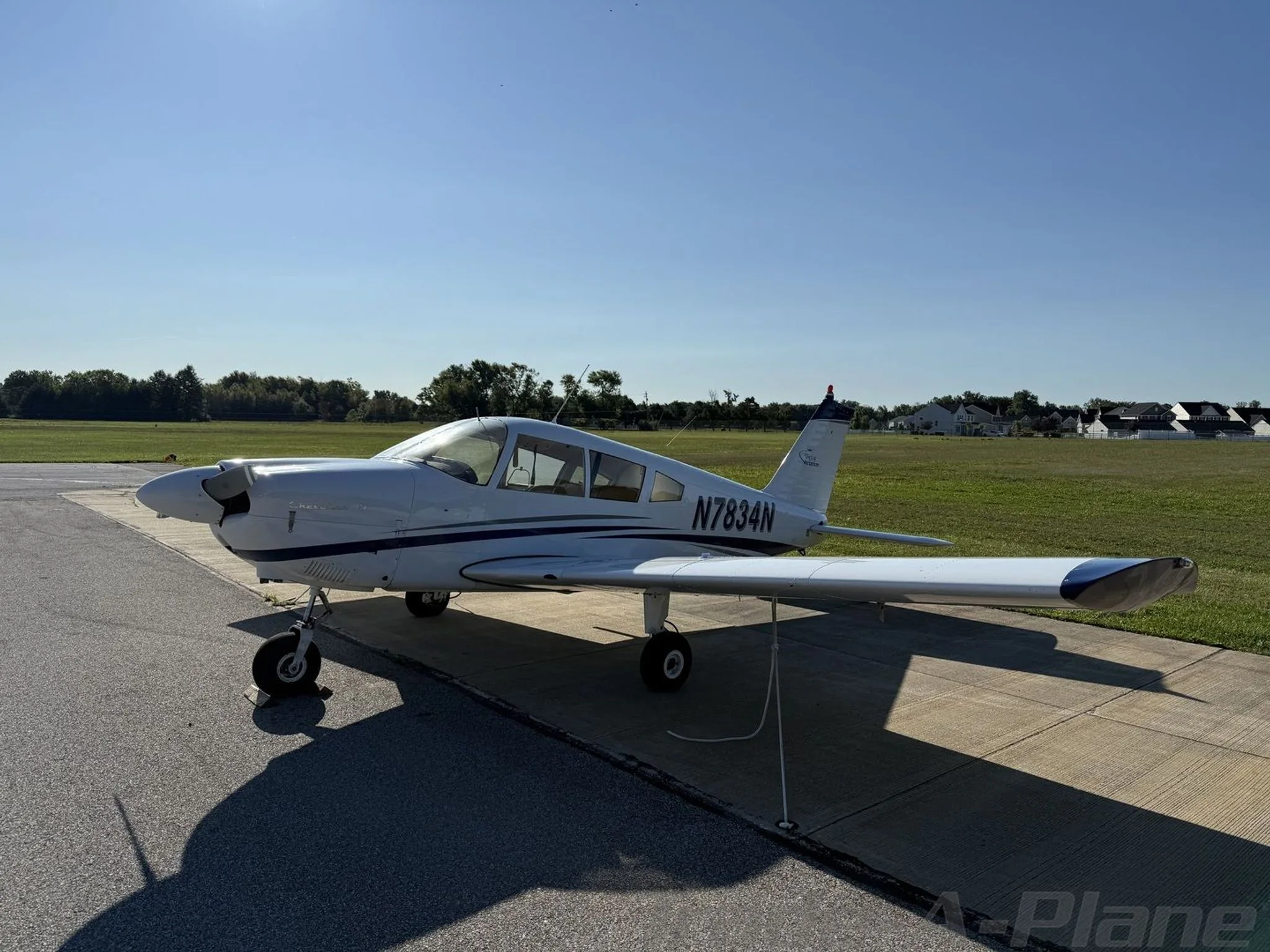 Another angle of the aircraft parked on the tarmac.