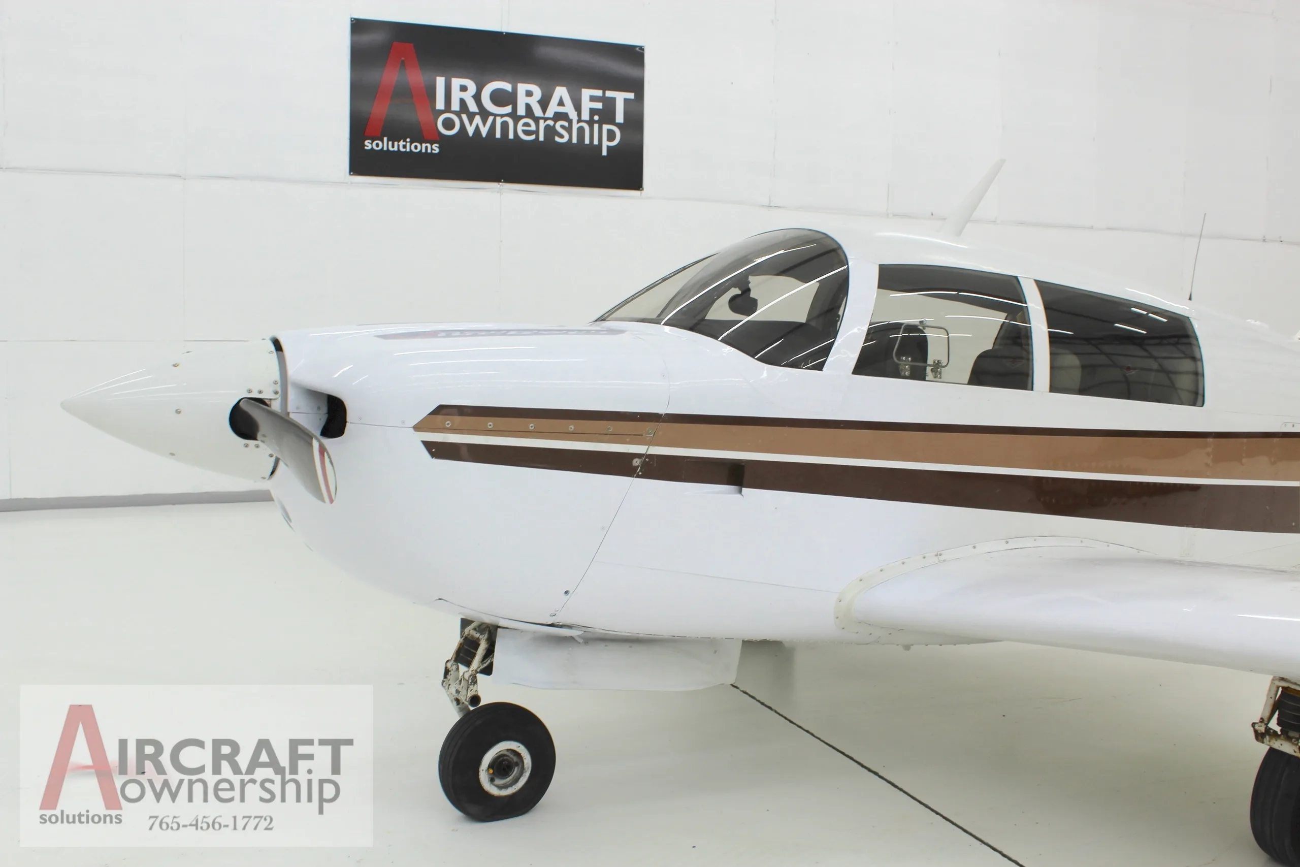 Close-up of the front of a Mooney M20J aircraft with registration N4341H.