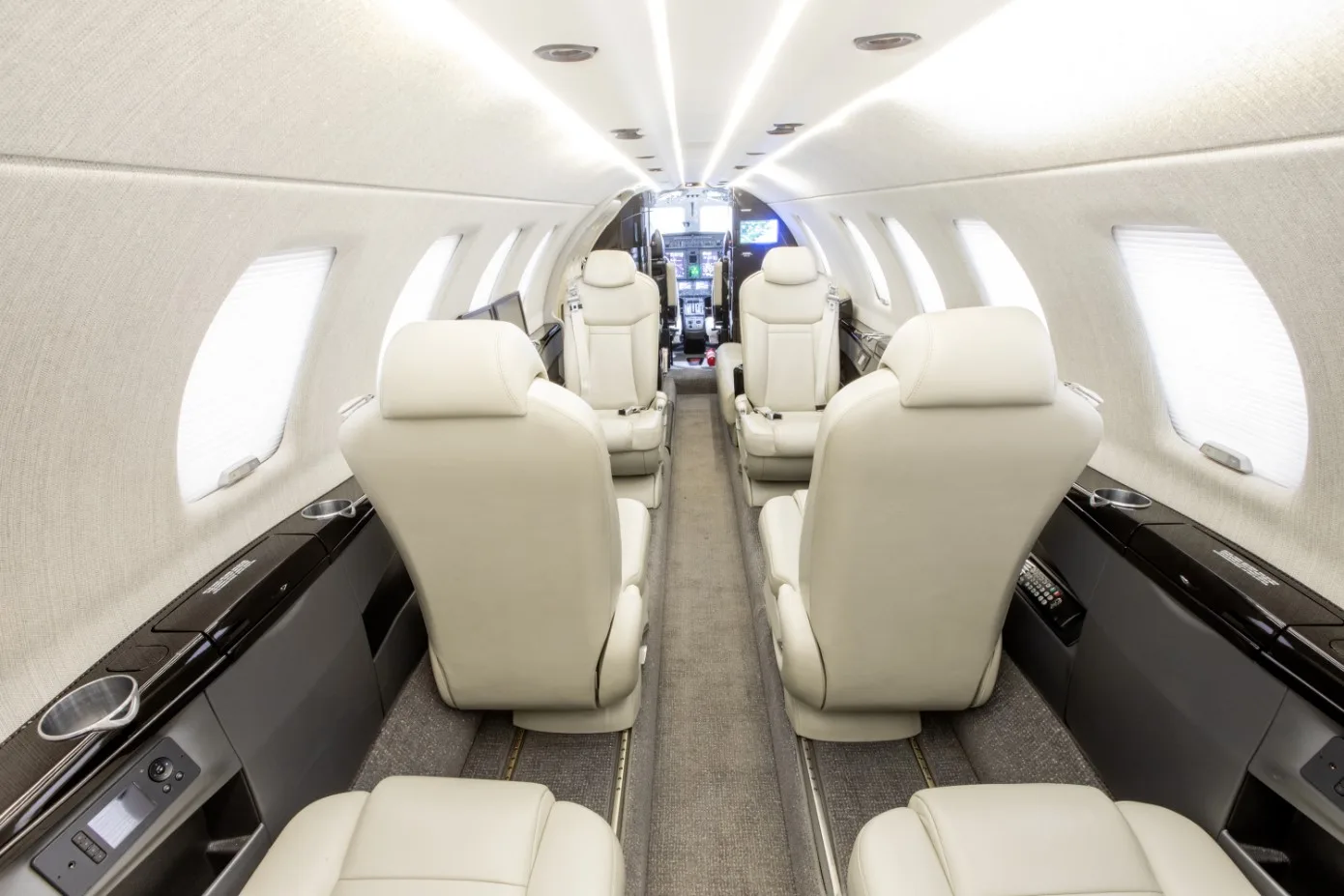 A view of the aircraft's interior, showing the seating arrangement and cockpit.