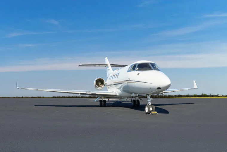 A white Cessna Citation business jet, registration N26XP, viewed from the front on a tarmac.