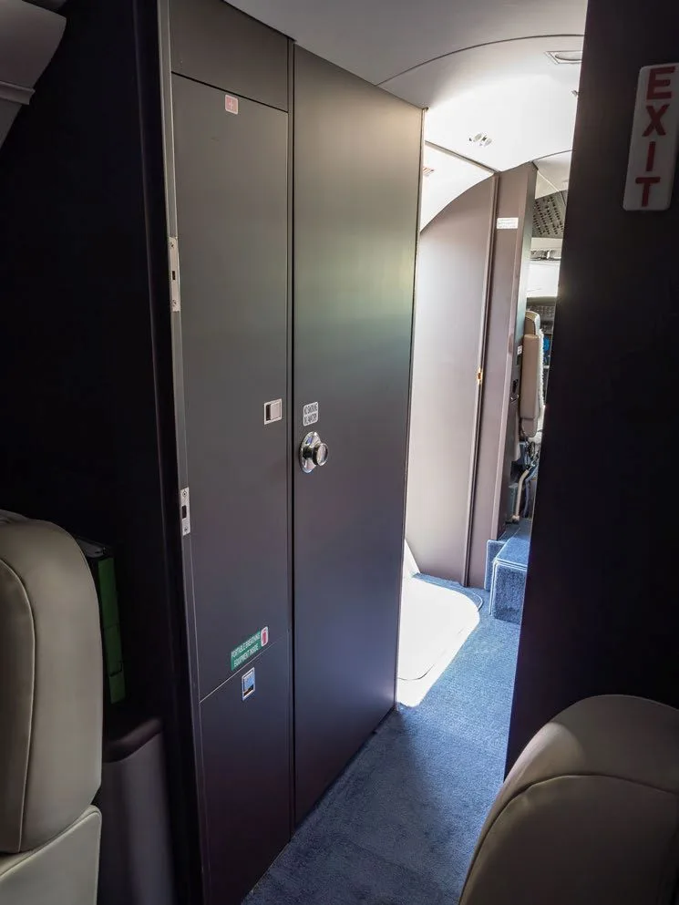 View of the aircraft interior with storage cabinets.