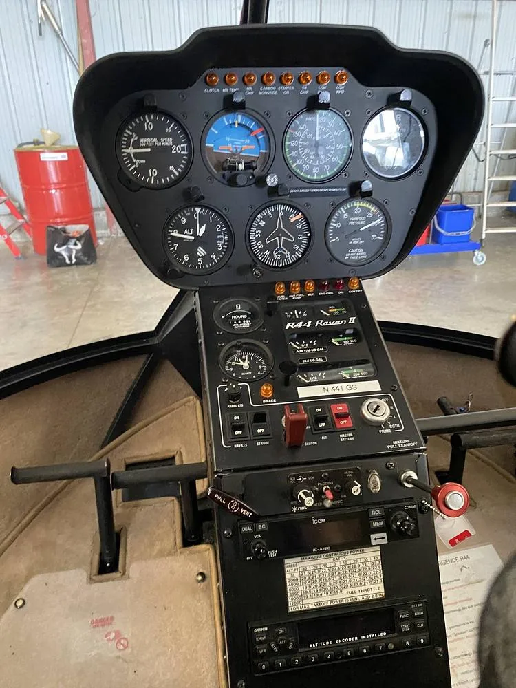 The instrument panel and controls of a Robinson R44 Raven II helicopter, showing registration N441GS.