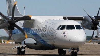 Close-up of an ATR 72 turboprop aircraft on the ground.