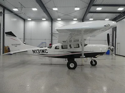 Cessna Stationair HD parked inside a hangar.