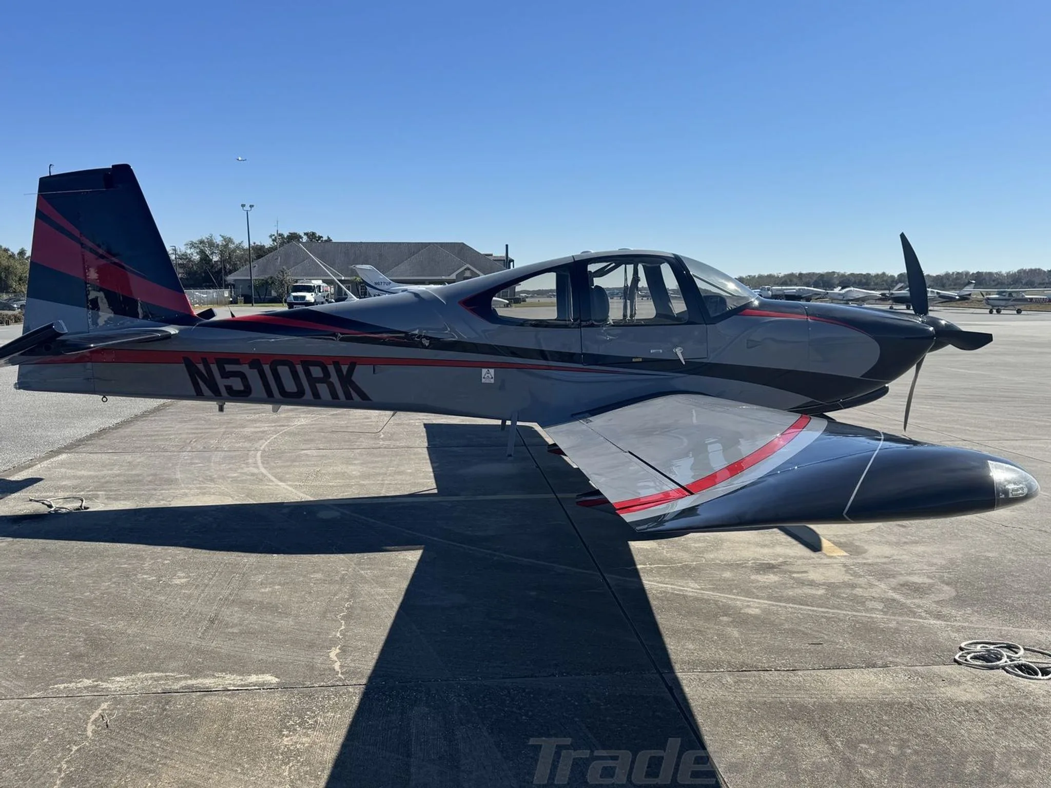 Aircraft positioned on the tarmac with a clear sky.