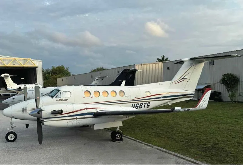 A King Air 200 aircraft with registration N66TG parked on the tarmac.