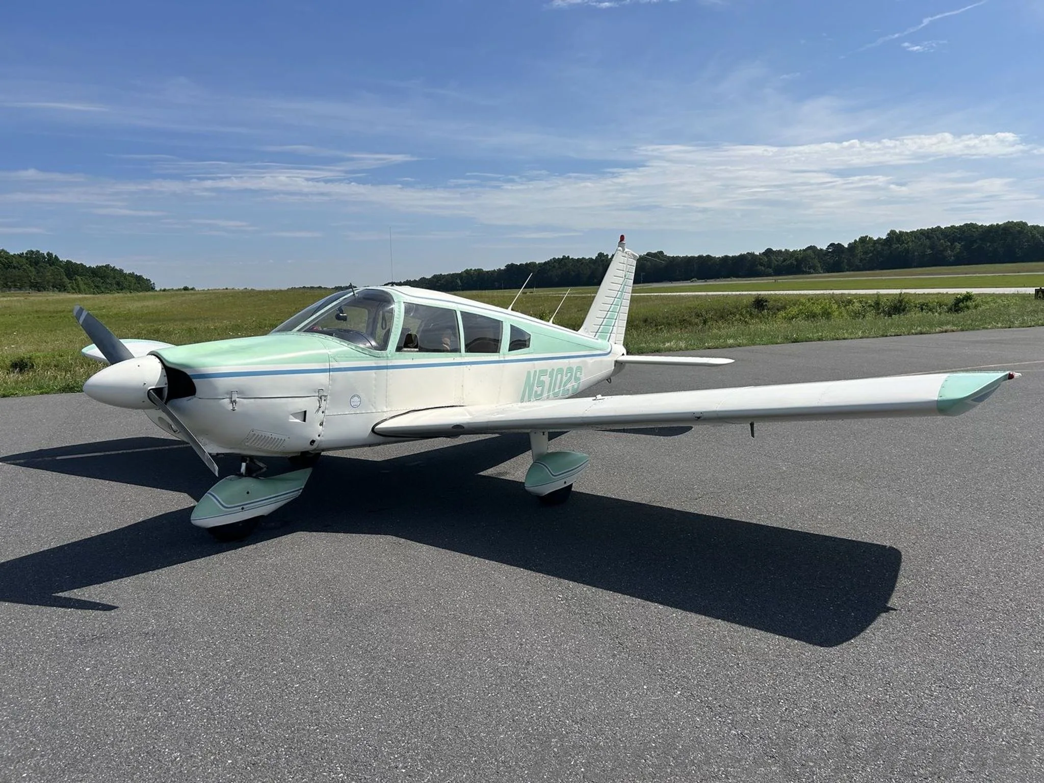 The Piper Cherokee 180 showcasing its front view.