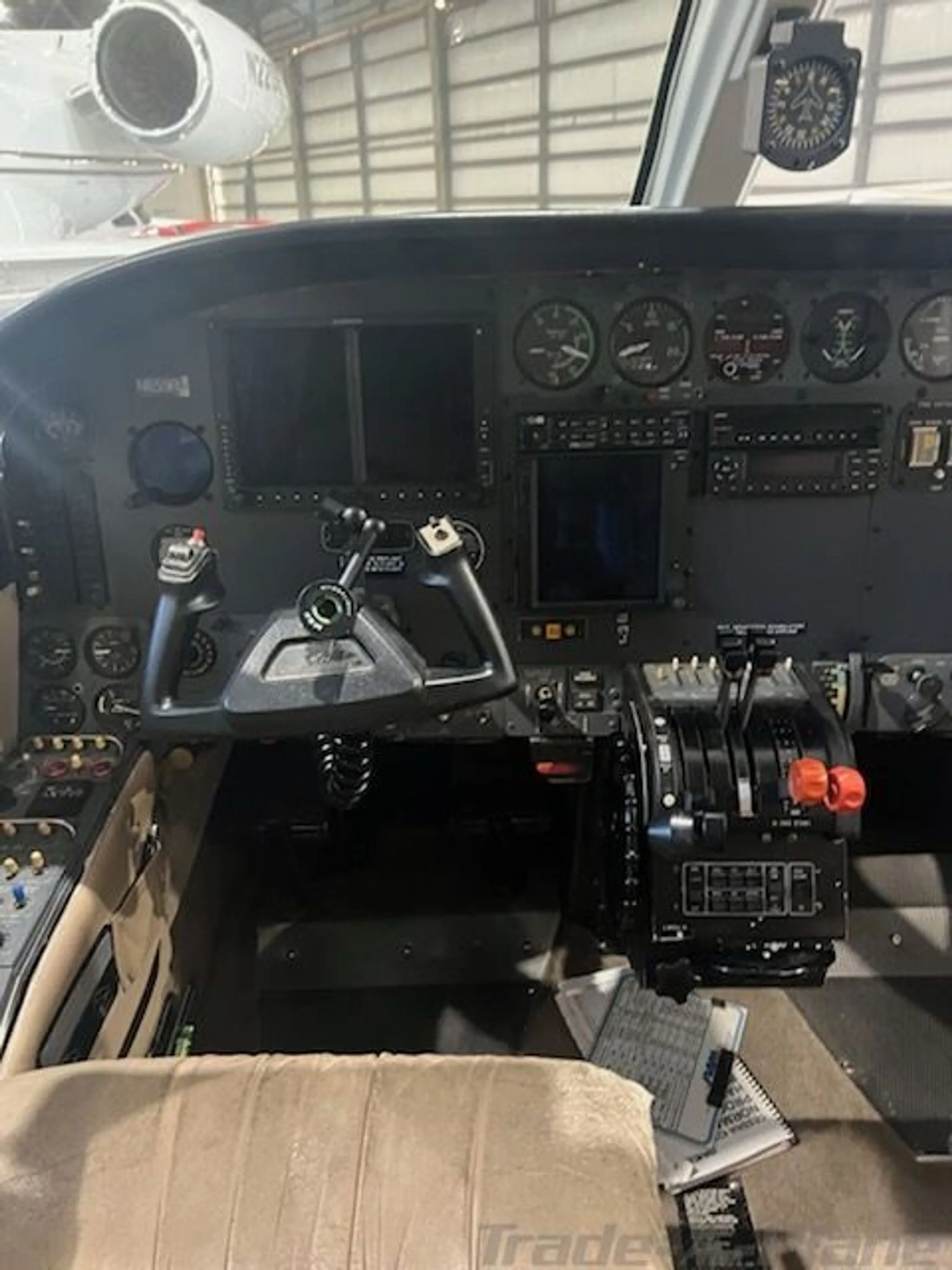 A close-up view of the instrument panel and controls in the cockpit of a Cessna 421C Golden Eagle.