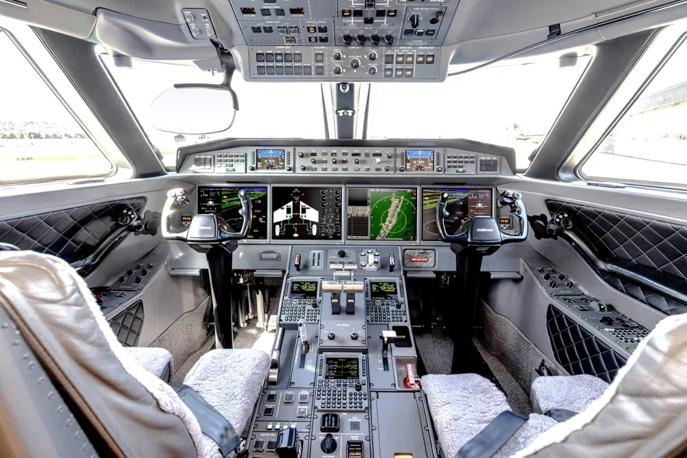 A detailed view of the aircraft's center console, showing the throttle quadrant and control panels.