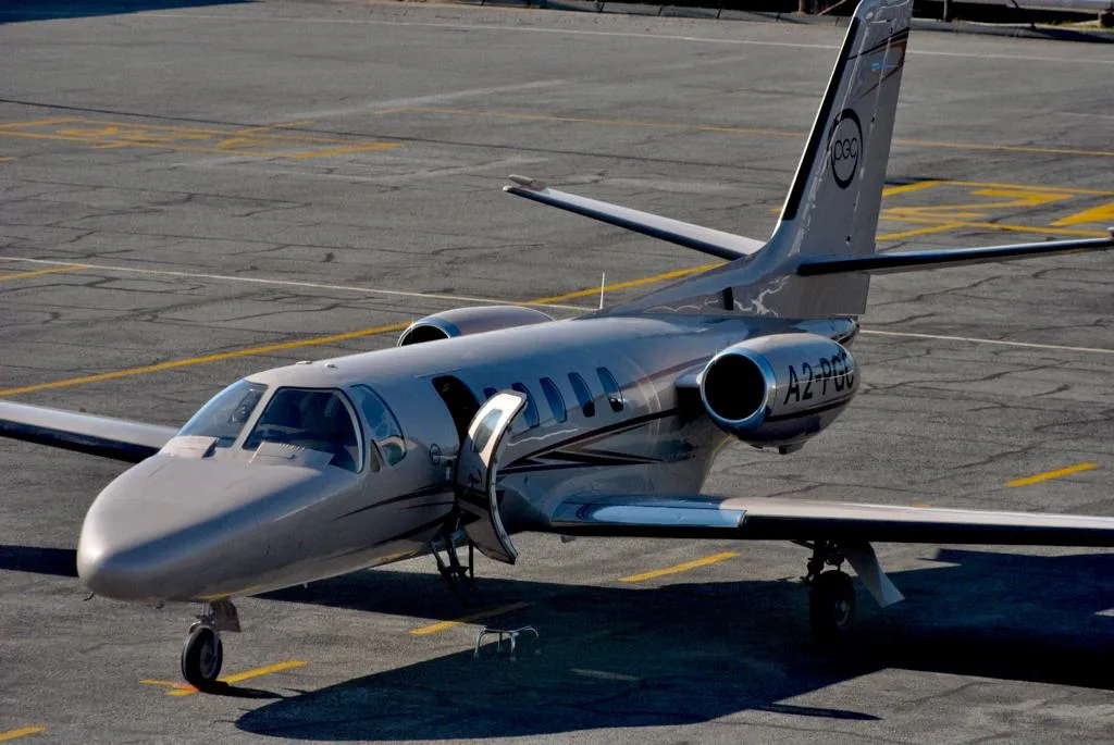 A2-PGC Cessna Citation Mustang on the tarmac with the door open.