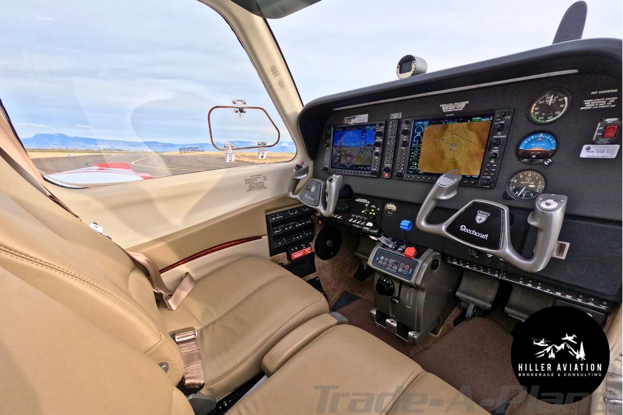 View of the cockpit of a Beechcraft Bonanza G36 with modern glass panel displays.