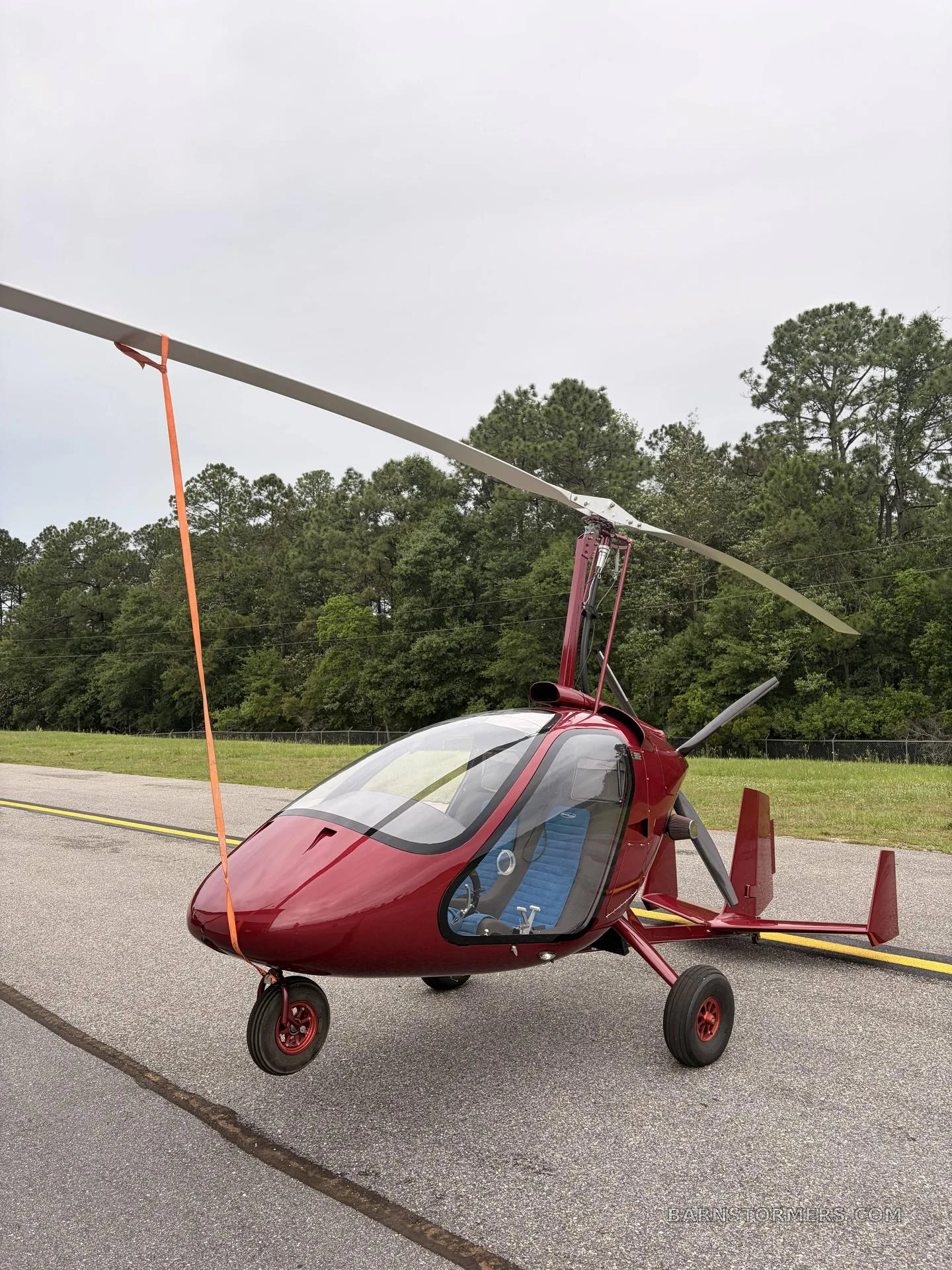 The MAGNI M24 GYRO on the runway with a clear background.