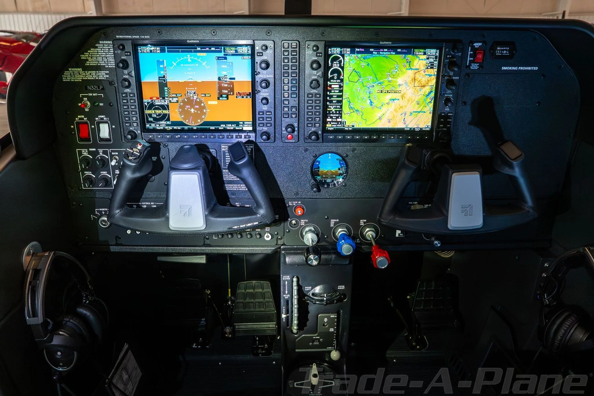 The modern glass cockpit of a Cessna Skylane, featuring dual Garmin G1000 displays and yokes.
