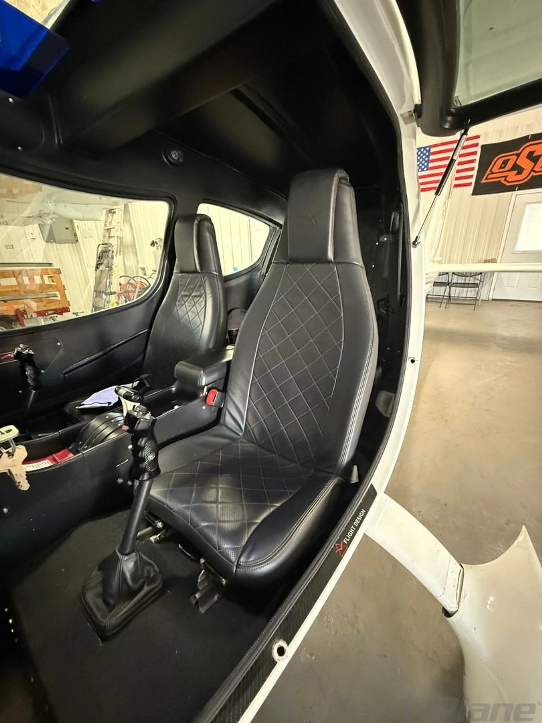A close-up of the pilot's seat inside the aircraft.