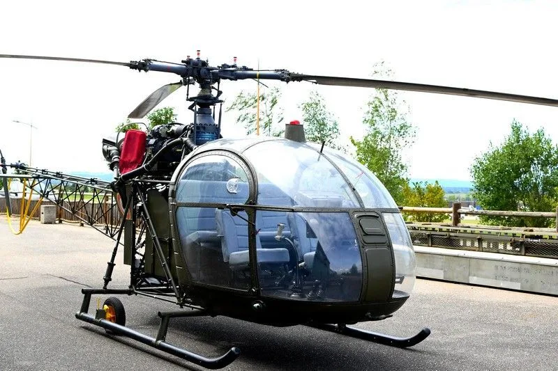 A 1959 Aerospatiale SE313B ALOUETTE-II helicopter parked outdoors.