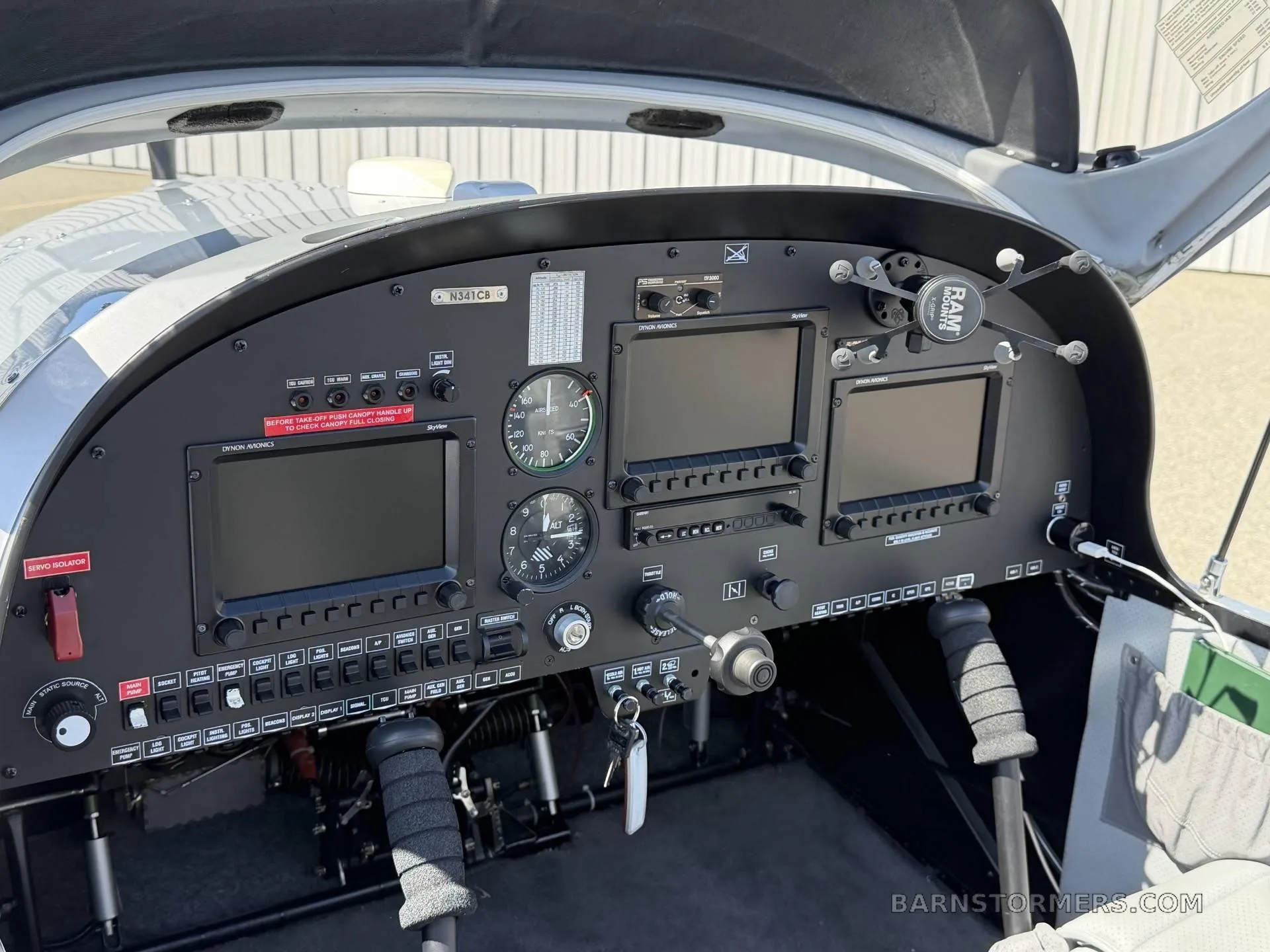 The cockpit of the SportStar MAX Turbo aircraft, showing the instrument panel with multiple digital displays and flight controls.